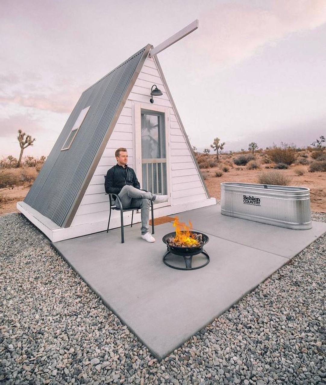 This meme is a still image from a TV show or movie, where a character is sitting on the porch of a small, rustic cabin, surrounded by a desert landscape. The image is captioned "I'm not arguing, I'm just explaining why I'm right." The character's calm and confident expression, as well as the peaceful surroundings, contrast with the idea of a heated argument, creating a humorous and ironic situation.